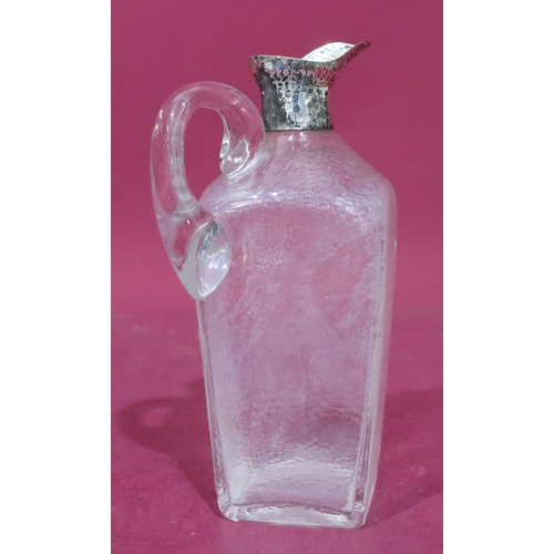 304 - A heavy cut glass square claret jug (no stopper) with hammered silver neck and spout, 24cm high