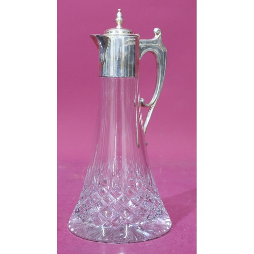 308 - A heavy cut glass claret jug with 925 plain silver neck, hinged lid and scroll handle, 30cm high