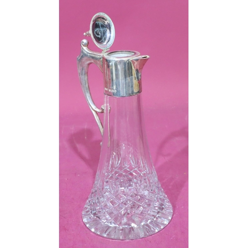 308 - A heavy cut glass claret jug with 925 plain silver neck, hinged lid and scroll handle, 30cm high