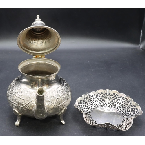 318 - An Eastern silver plated round bulbous shaped teapot with embossed decoration, scroll handle on spla... 