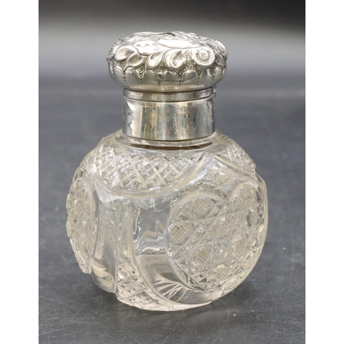 321 - A cut glass round bulbous shaped dressing table bottle with Birmingham silver neck, hinged lid with ... 