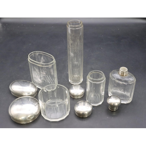 322 - A set of 5 cut glass dressing table pots with London silver tops, 2.8oz gross (5)