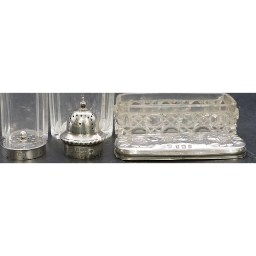 323 - A cut glass round sifter with silver top, a square cut glass mustard pot with silver top and a cut g... 