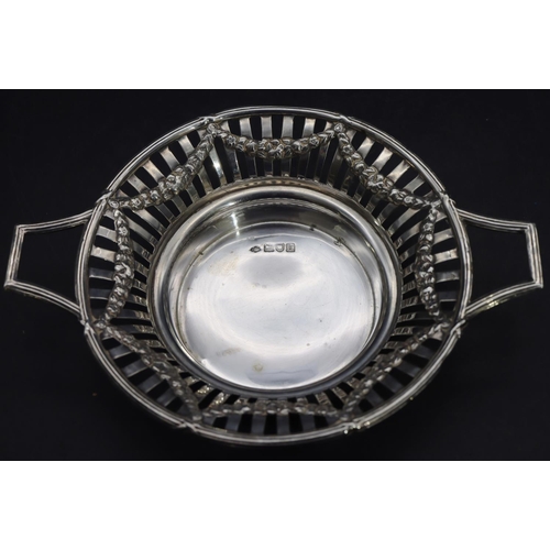 330 - A London silver round 2-handled sweetmeat dish with pierced gallery and raised swag decoration, 16.3... 