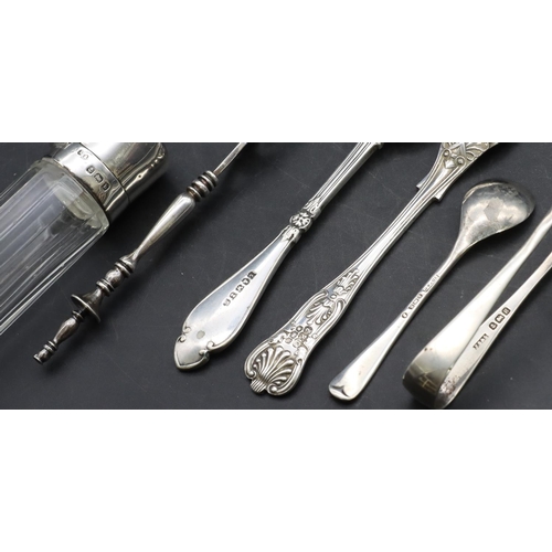 334 - A cut glass scent bottle with silver hinged lid, a Continental silver spoon, a silver mustard spoon,... 