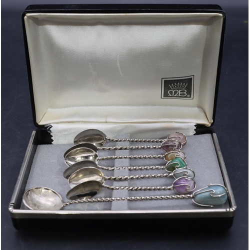 339 - A set of 6 Continental teaspoons mounted with coloured stones and a similar larger spoon