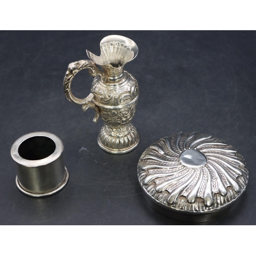 341 - A silver coloured metal small round bulbous shaped ewer with embossed floral and scroll decoration, ... 