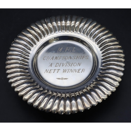 354 - An Eastern silver round scallop shaped dish with embossed rim and engraved inscription on 3 splayed ... 