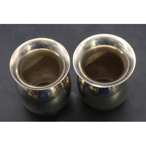 355 - A pair of Eastern silver coloured metal small round bulbous trumpet shaped pots 5cm high, 1.2oz