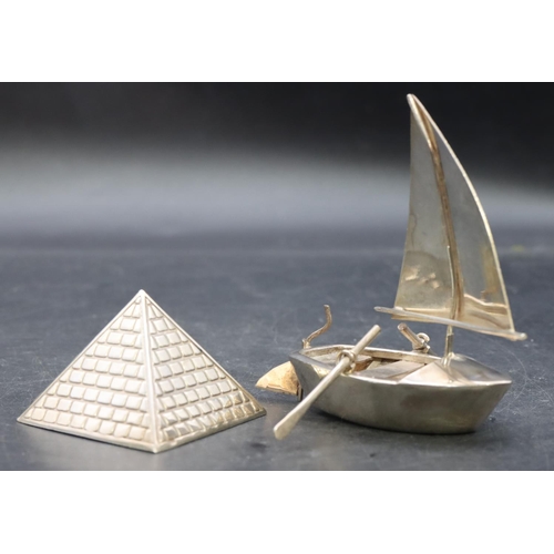 356 - A silver coloured metal paperweight in the form of a pyramid, 4cm high and a Continental silver colo... 