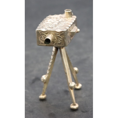 357 - A silver coloured metal miniature model of a box camera on a tripod, 7.5cm high, 1.5oz