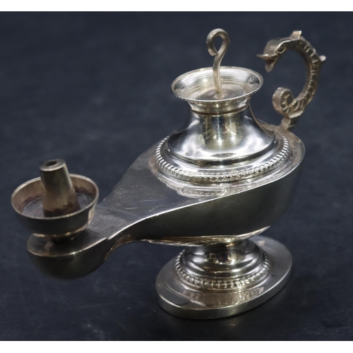 358 - A Continental silver coloured metal small oil lamp with cover, 10.5cm long, 2.3oz