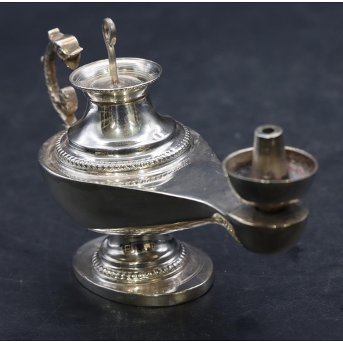 358 - A Continental silver coloured metal small oil lamp with cover, 10.5cm long, 2.3oz