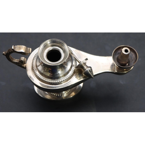 358 - A Continental silver coloured metal small oil lamp with cover, 10.5cm long, 2.3oz