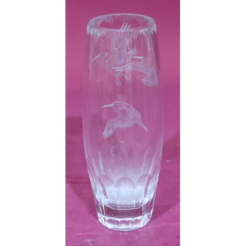 36 - A heavy cut glass round bulbous shaped vase with engraved bird decoration, 28cm high