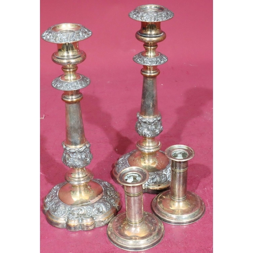 366 - A pair of Sheffield silver plated candlesticks on turned stems with round scallop shaped bases with ... 