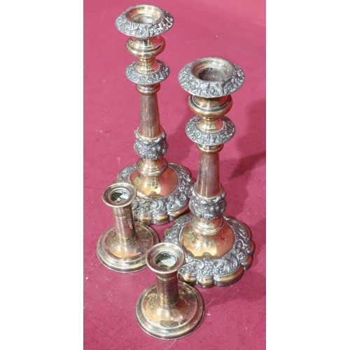 366 - A pair of Sheffield silver plated candlesticks on turned stems with round scallop shaped bases with ... 