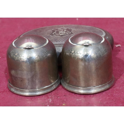 369 - A pair Birmingham silver circular inkwells with collapsible lids, 4.5cm high also an oval silver pla... 