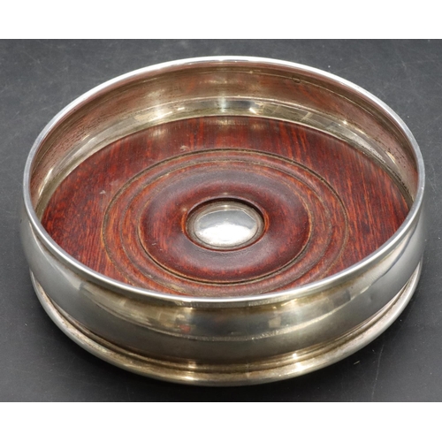 372 - A modern London silver round bulbous shaped coaster with wooden centre, 13.5cm diameter