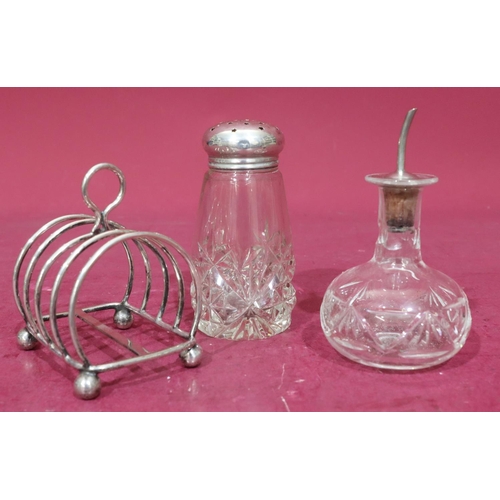 374 - A cut glass round sugar caster with silver screw lid, 13cm high, a glass vinegar bottle with stopper... 