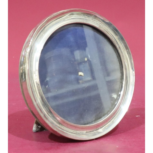 375 - A Chester silver circular free standing photograph frame with velvet back, 15.2cm diameter (some sli... 