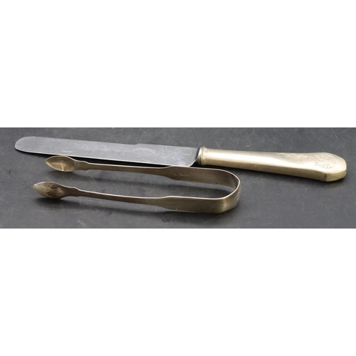 379 - A pair of Georgian silver sugar tongs, 1.1oz and a Continental silver coloured metal handled knife (... 