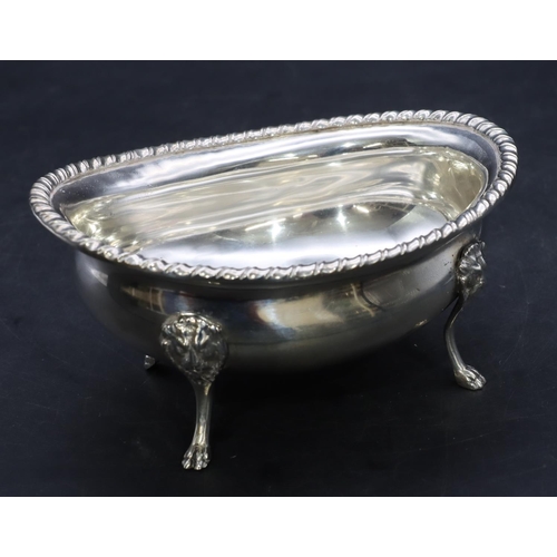 386 - A Continental 800 silver coloured metal oval sugar bowl with gadroon rim on 4 splayed lion head claw... 