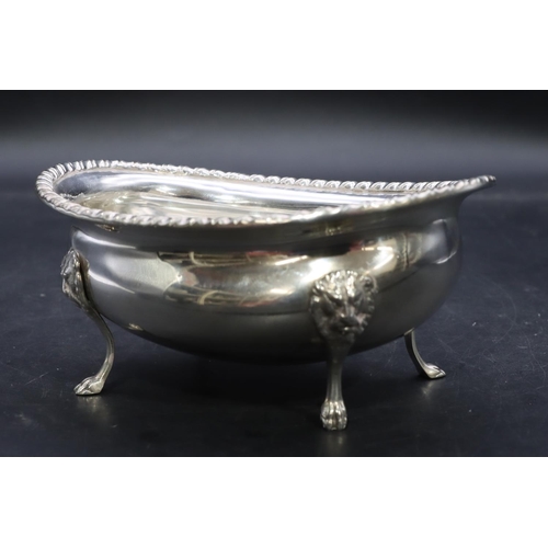 386 - A Continental 800 silver coloured metal oval sugar bowl with gadroon rim on 4 splayed lion head claw... 