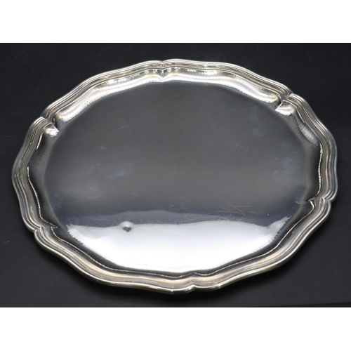 388 - A Continental 800 silver coloured metal round scallop shaped tray, 28.5cm diameter, 15.9oz