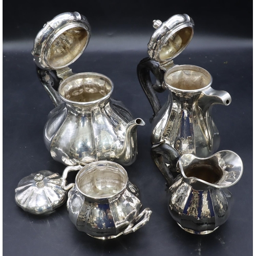 391 - A 4-piece Continental 800 silver coloured metal round bulbous shaped tea service with ebonised scrol... 