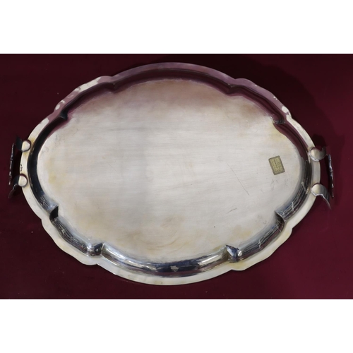 392 - A Continental 800 silver coloured metal oval scallop shaped 2-handle tray, 53cm wide, 55.1oz