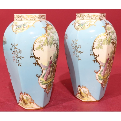 40 - A pair of modern Royal Worcester fine bone china hexagonal bulbous thin neck vases on turquoise grou... 