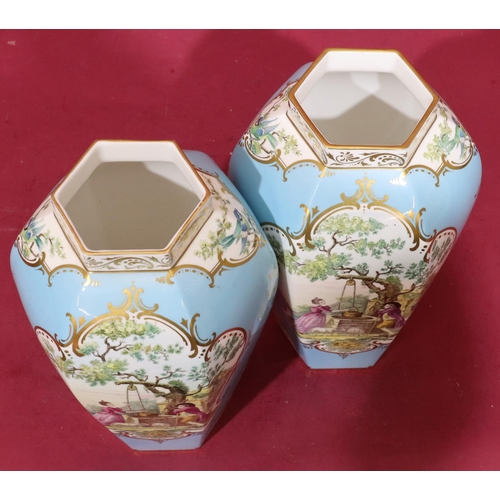 40 - A pair of modern Royal Worcester fine bone china hexagonal bulbous thin neck vases on turquoise grou... 