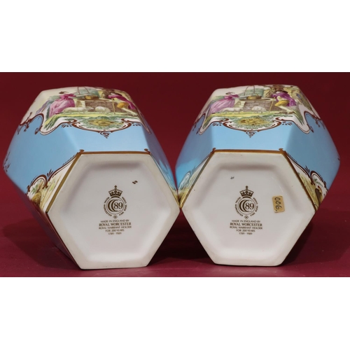 40 - A pair of modern Royal Worcester fine bone china hexagonal bulbous thin neck vases on turquoise grou... 