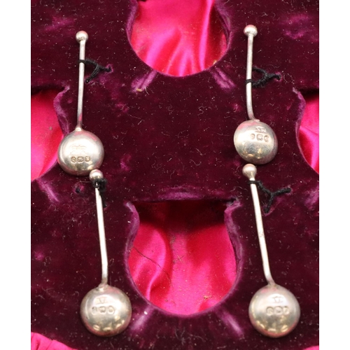 411 - A set of 4 Sheffield silver round bulbous shaped salts, each on 3 splayed feet with matching spoons,... 