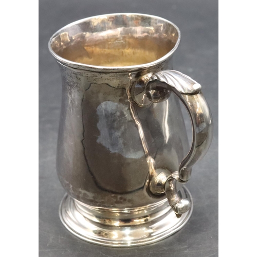 413 - An early George III silver christening mug with scroll handle on sweeping foot, London 1761 (dent ab... 