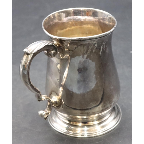 413 - An early George III silver christening mug with scroll handle on sweeping foot, London 1761 (dent ab... 