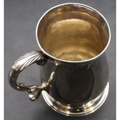 413 - An early George III silver christening mug with scroll handle on sweeping foot, London 1761 (dent ab... 