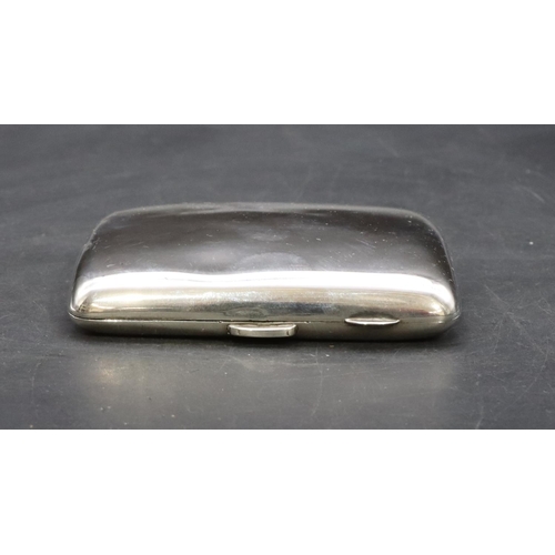 422 - A Birmingham silver concave shaped plain cigarette case, 3.2oz.