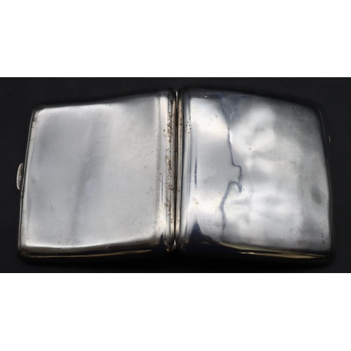 422 - A Birmingham silver concave shaped plain cigarette case, 3.2oz.