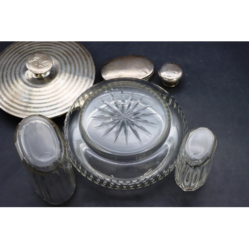 425 - A cut glass round bulbous shaped dressing table pot with silver top and an oval cut glass dressing t... 