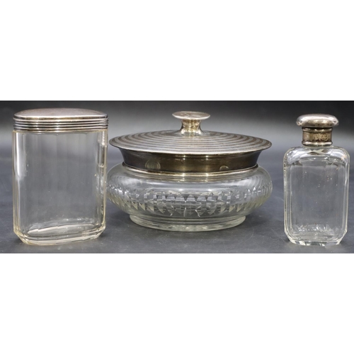 425 - A cut glass round bulbous shaped dressing table pot with silver top and an oval cut glass dressing t... 