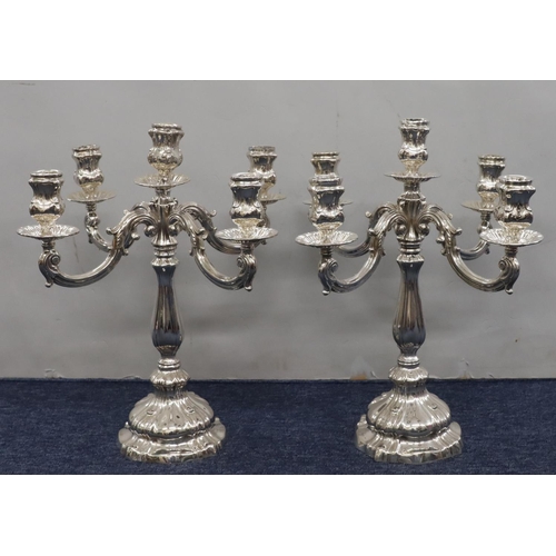 427 - A pair of Continental 800 silver coloured metal 4-branch 5-light candelabras on weighted bulbous ste... 