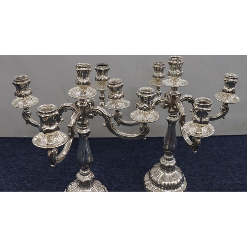 427 - A pair of Continental 800 silver coloured metal 4-branch 5-light candelabras on weighted bulbous ste... 