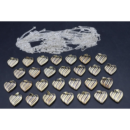 446 - 28 silver and silver gilt small heart shaped pendants, 3cm high, a quantity of various matching silv... 