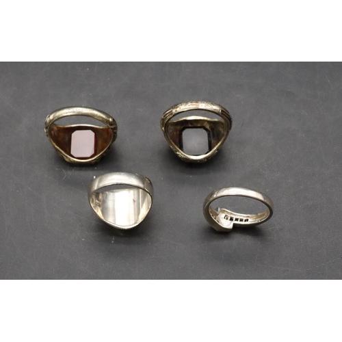 452 - An 835 silver gilt signet ring set with red stone, a similar 800 silver gilt signet set with black s... 