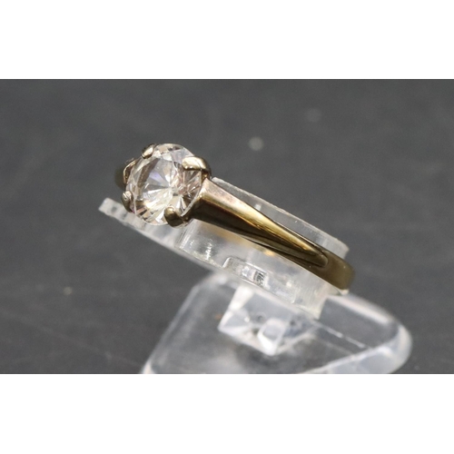 457 - A 333 gold solitaire ring set with clear stone, Size P/Q, 1.1 grams gross