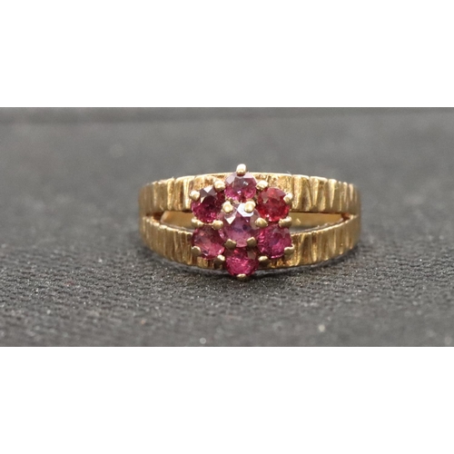 458 - A 9ct gold ladies' cluster ring set with small red stones, Size P/Q, 3.6 grams gross