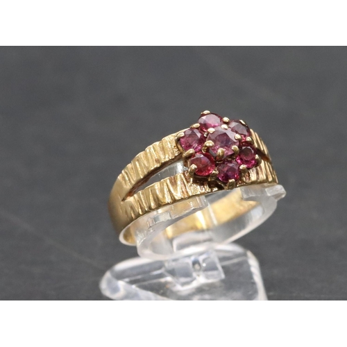 458 - A 9ct gold ladies' cluster ring set with small red stones, Size P/Q, 3.6 grams gross