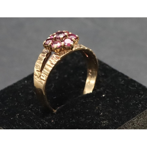 458 - A 9ct gold ladies' cluster ring set with small red stones, Size P/Q, 3.6 grams gross